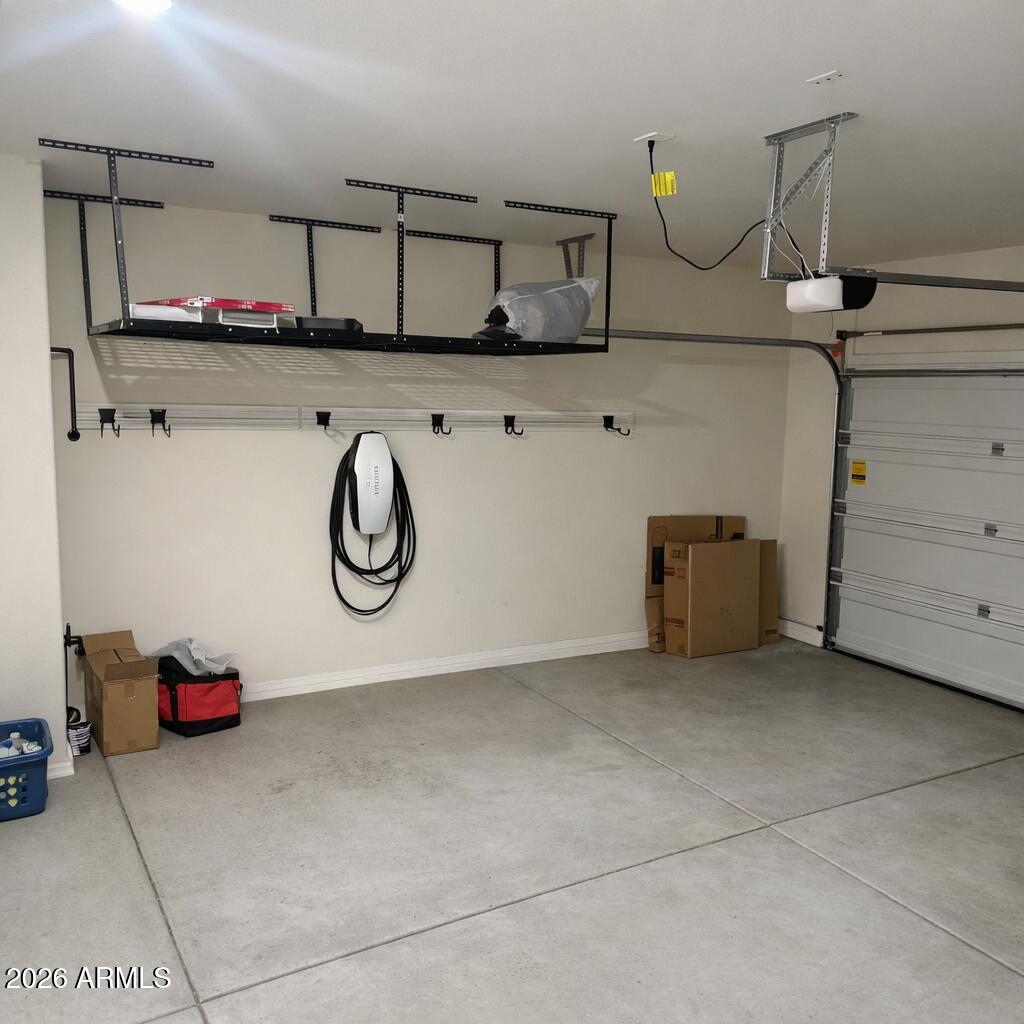 5208 East Emery Road San Tan Valley, AZ 85143 - Photo 20 of 30 a kitchen with cabinets and wooden floor
