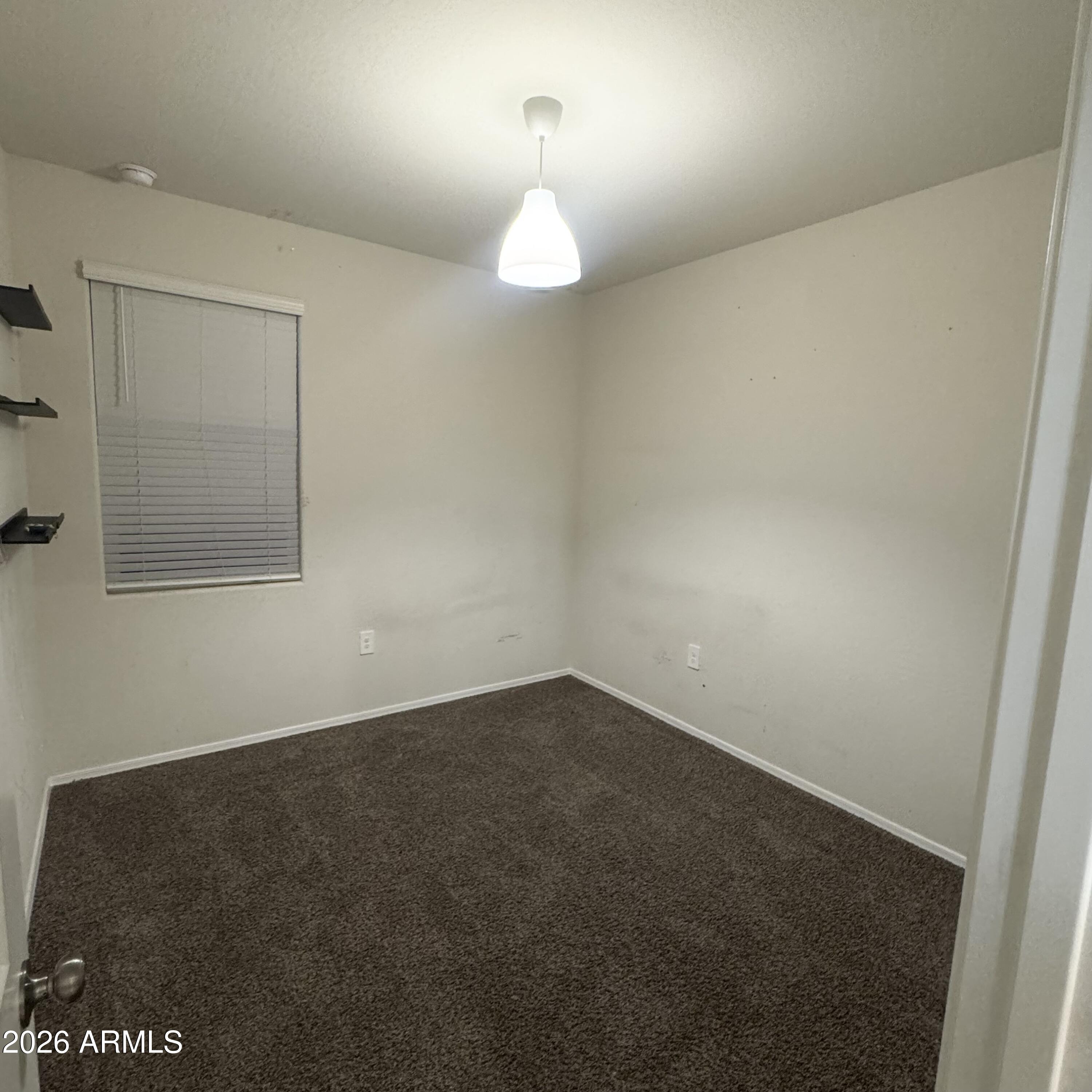 5208 East Emery Road San Tan Valley, AZ 85143 - Photo 23 of 30 a view of an empty room with a window