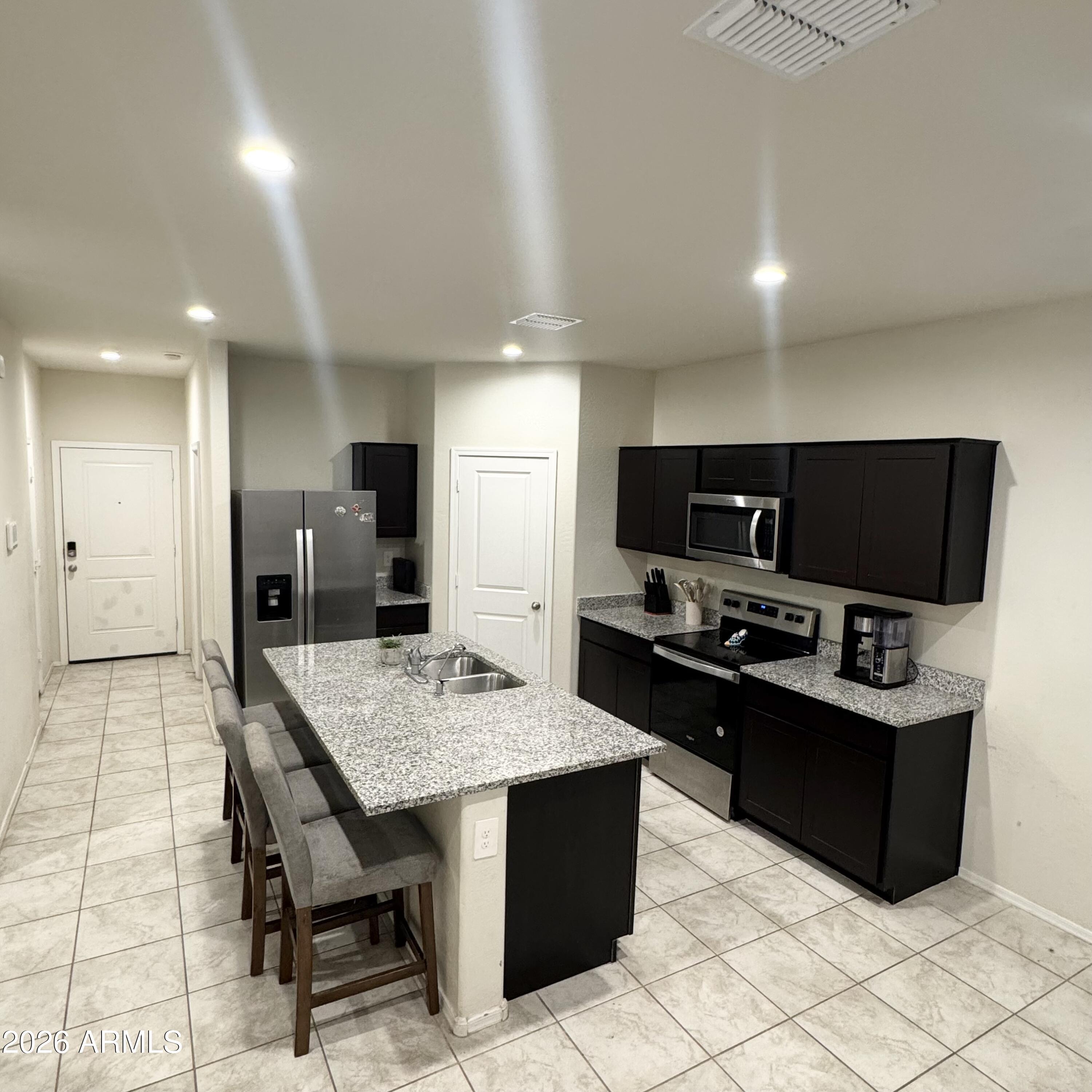 5208 East Emery Road San Tan Valley, AZ 85143 - Photo 5 of 30 a large kitchen with cabinets