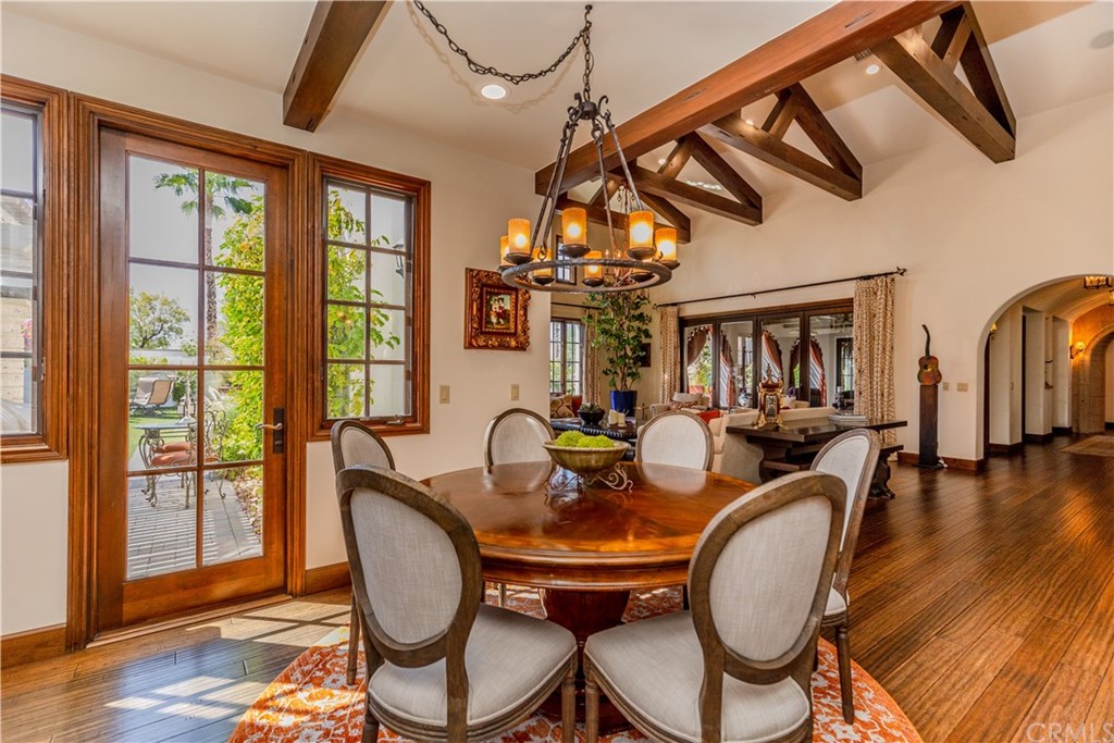 17 Cassis Circle Rancho Mirage, CA 92270 - Photo 16 of 75 a dining room with furniture a chandelier and wooden floor