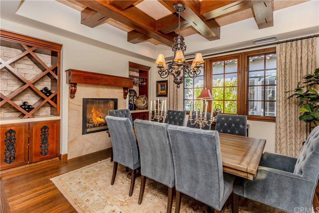 17 Cassis Circle Rancho Mirage, CA 92270 - Photo 28 of 75 a living room with furniture and a chandelier