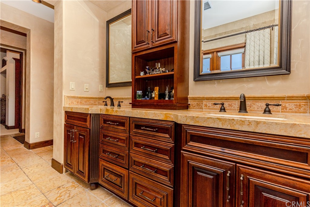 17 Cassis Circle Rancho Mirage, CA 92270 - Photo 37 of 75 a kitchen with stainless steel appliances a sink and cabinets