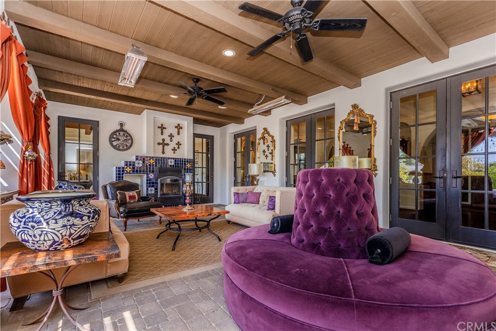 17 Cassis Circle Rancho Mirage, CA 92270 - Photo 55 of 75 a living room with furniture and a chandelier