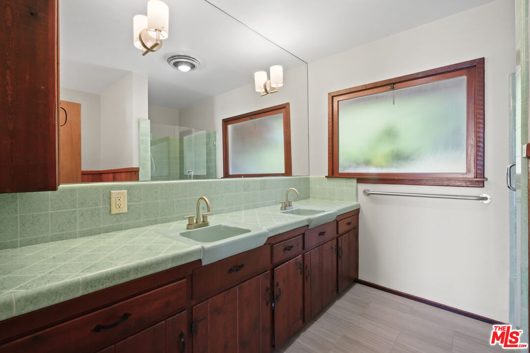 3217 Colony View Circle Malibu, CA 90265 - Photo 11 of 23 a bathroom with a sink and a mirror