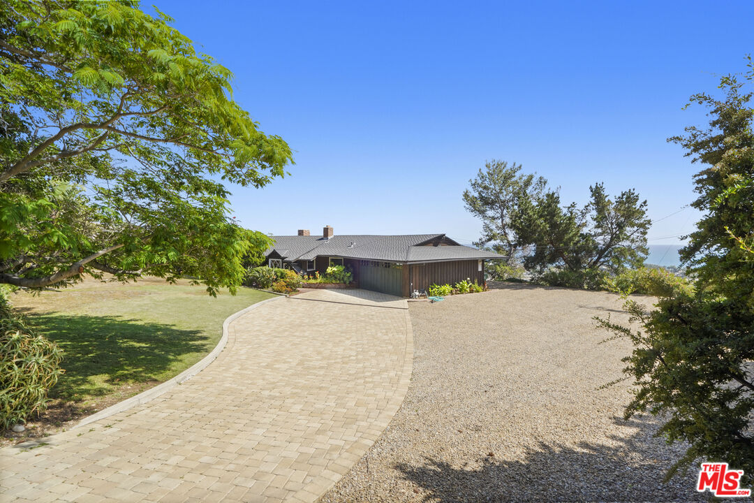 3217 Colony View Circle Malibu, CA 90265 - Photo 22 of 23 a view of a house with a yard and basketball court