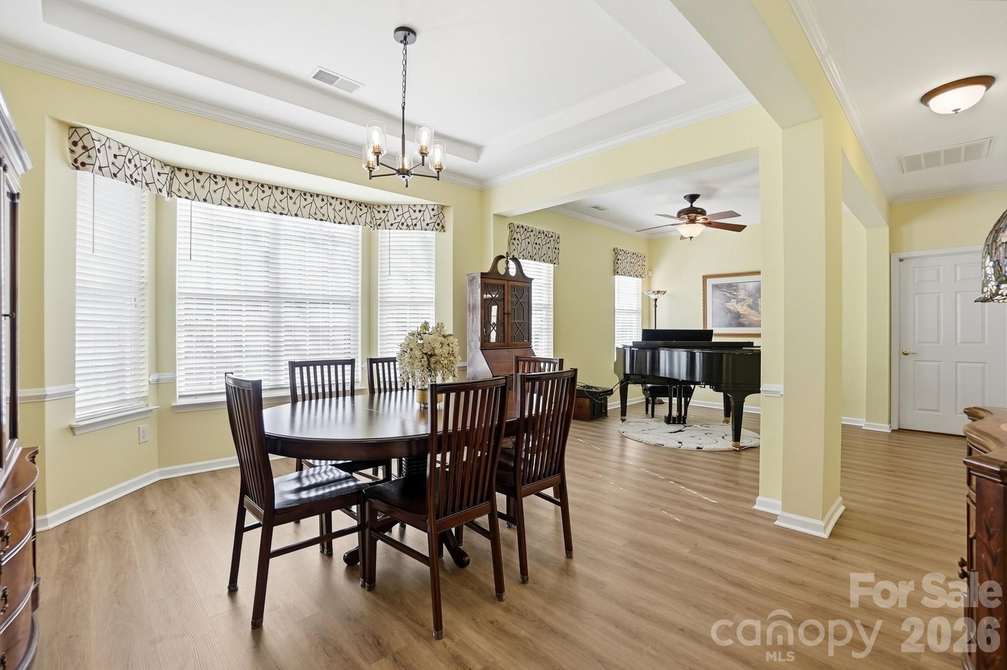 1667 Onyx Ridge Fort Mill, SC 29708 - Photo 12 of 25 a view of a dining room with furniture window and wooden floor