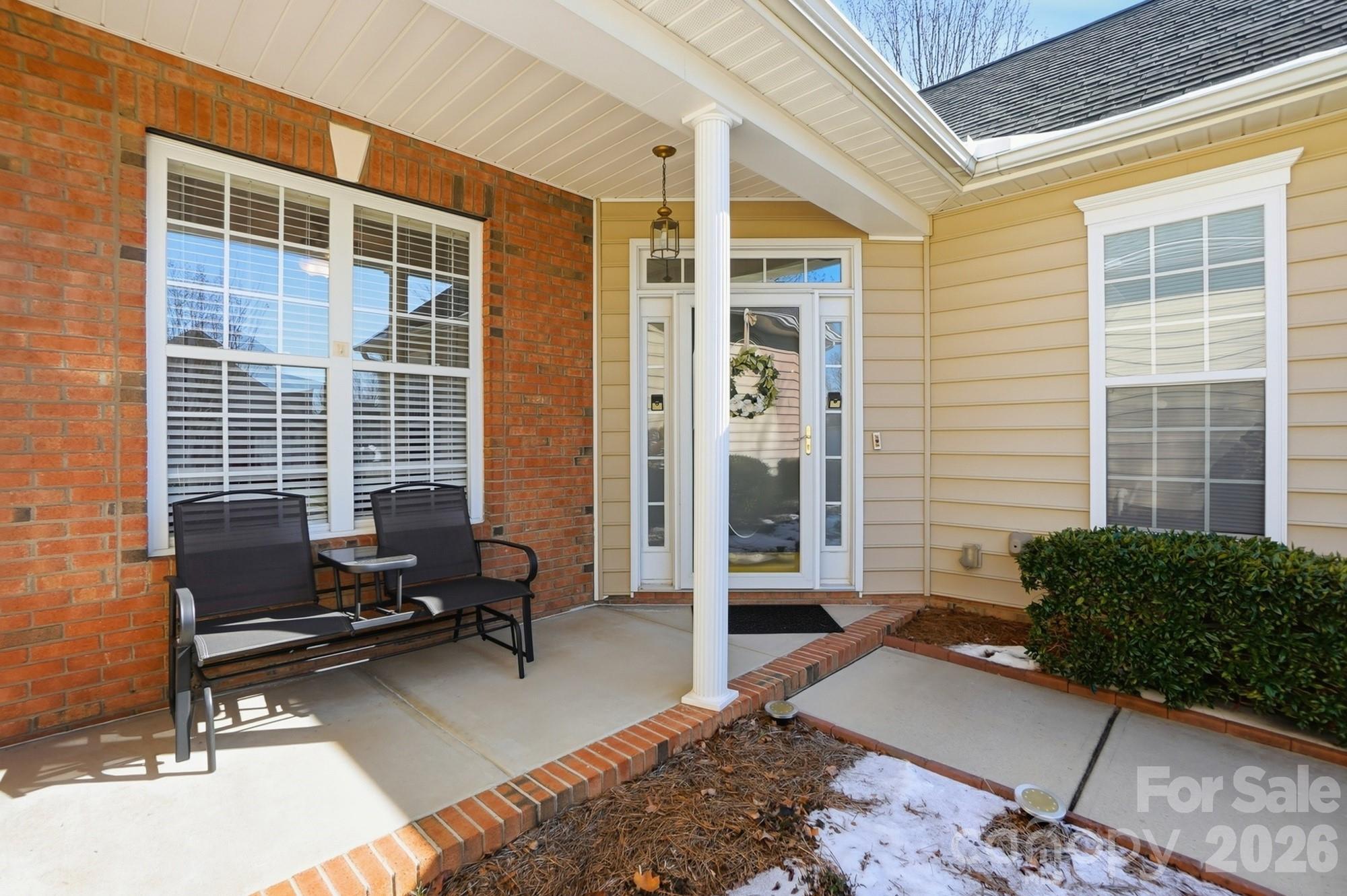 1667 Onyx Ridge Fort Mill, SC 29708 - Photo 2 of 25 a building outdoor space with patio furniture and potted plants