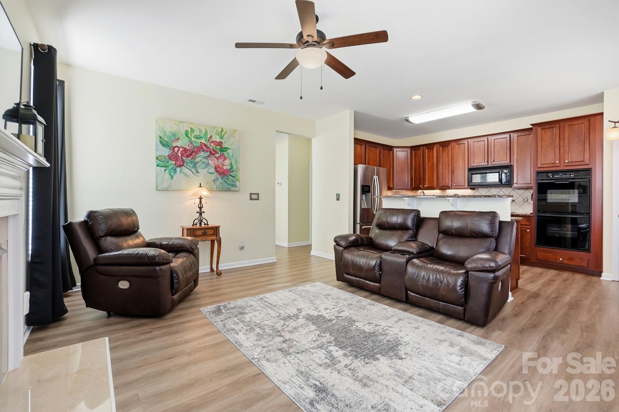 1667 Onyx Ridge Fort Mill, SC 29708 - Photo 6 of 25 a living room with furniture and a flat screen tv