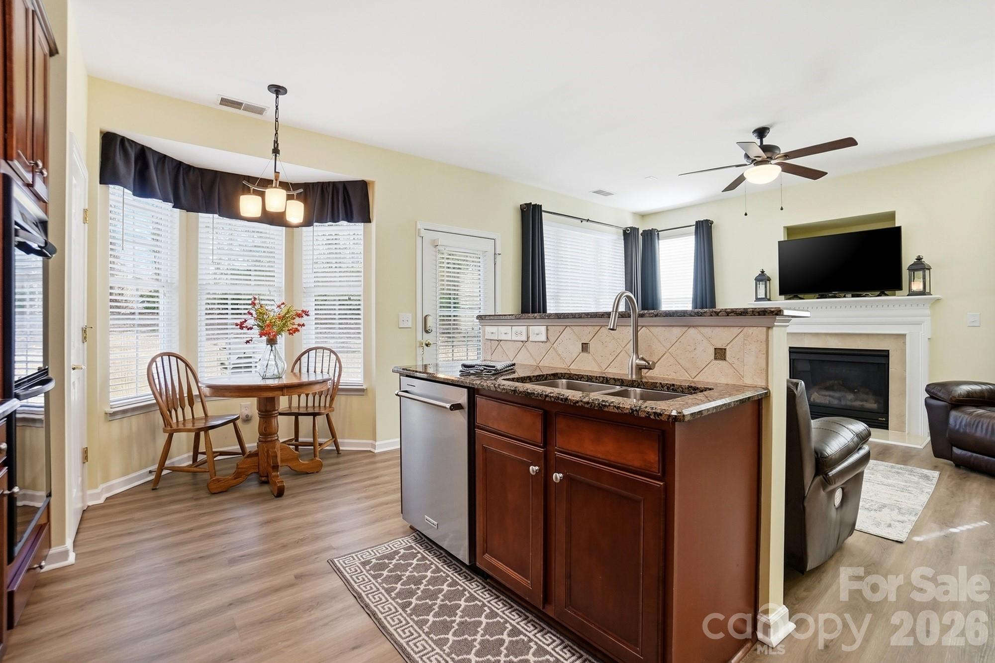 1667 Onyx Ridge Fort Mill, SC 29708 - Photo 9 of 25 a kitchen with a stove a sink and a refrigerator