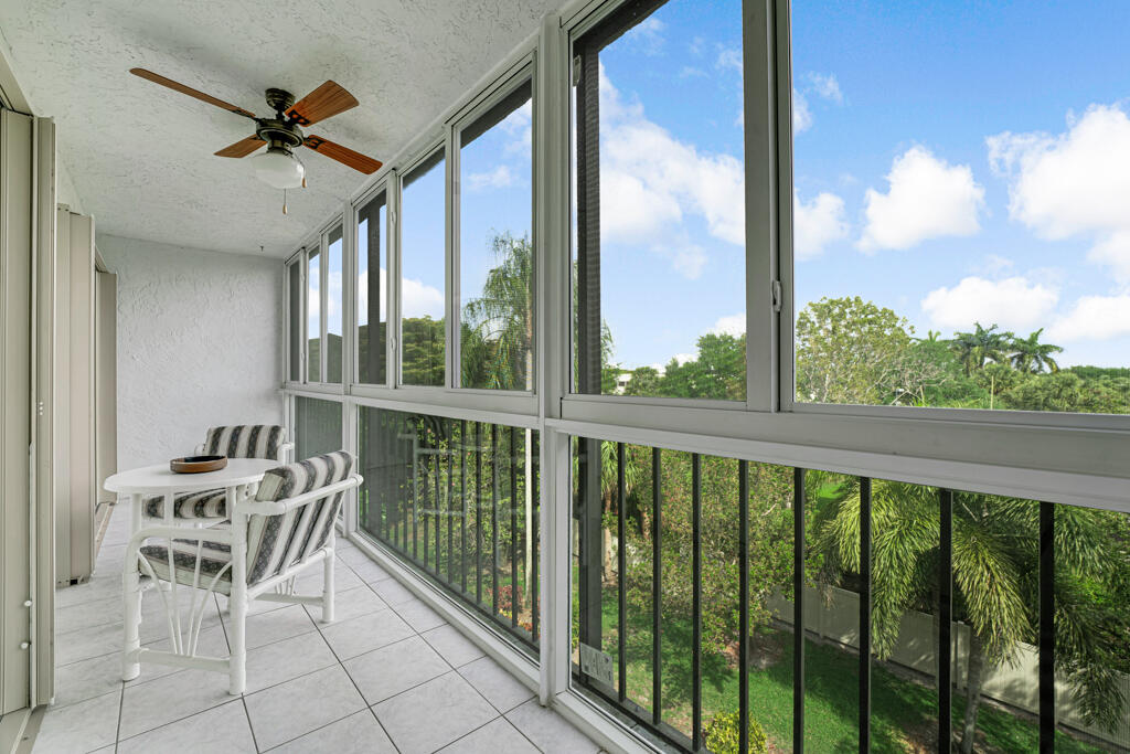7301 Amberly Lane, Unit 407 Delray Beach, FL 33446 - Photo 20 of 23 a view of a balcony with chairs