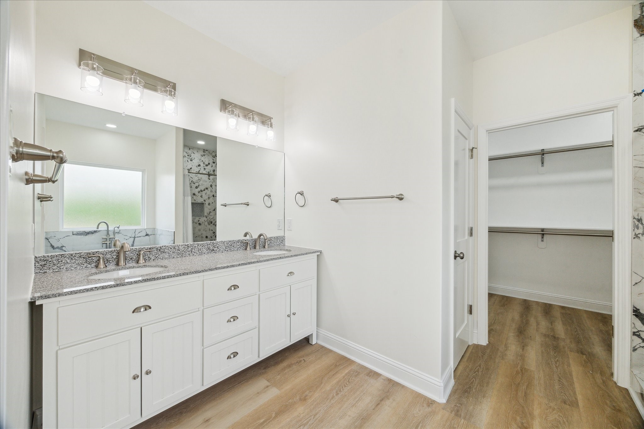 901 East 37th Street Houston, TX 77022 - Photo 9 of 19 a bathroom with a granite countertop sink and a mirror