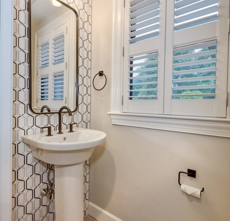 27 Cabot Street Winchester, MA 01890 - Photo 12 of 42 a bathroom with a sink and a window