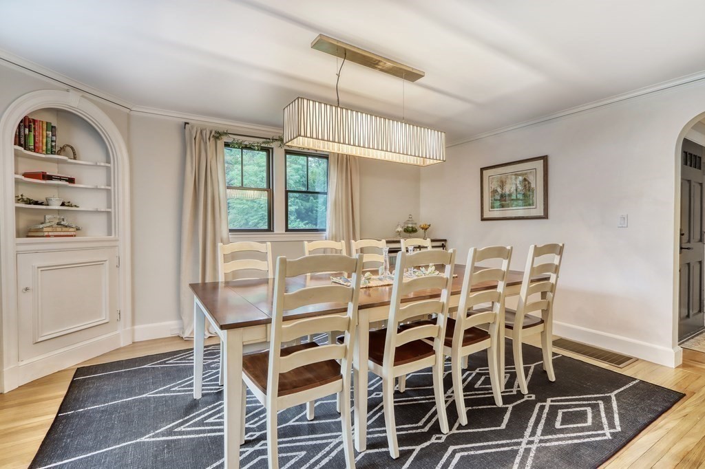 27 Cabot Street Winchester, MA 01890 - Photo 14 of 42 a dining room with furniture a chandelier and wooden floor
