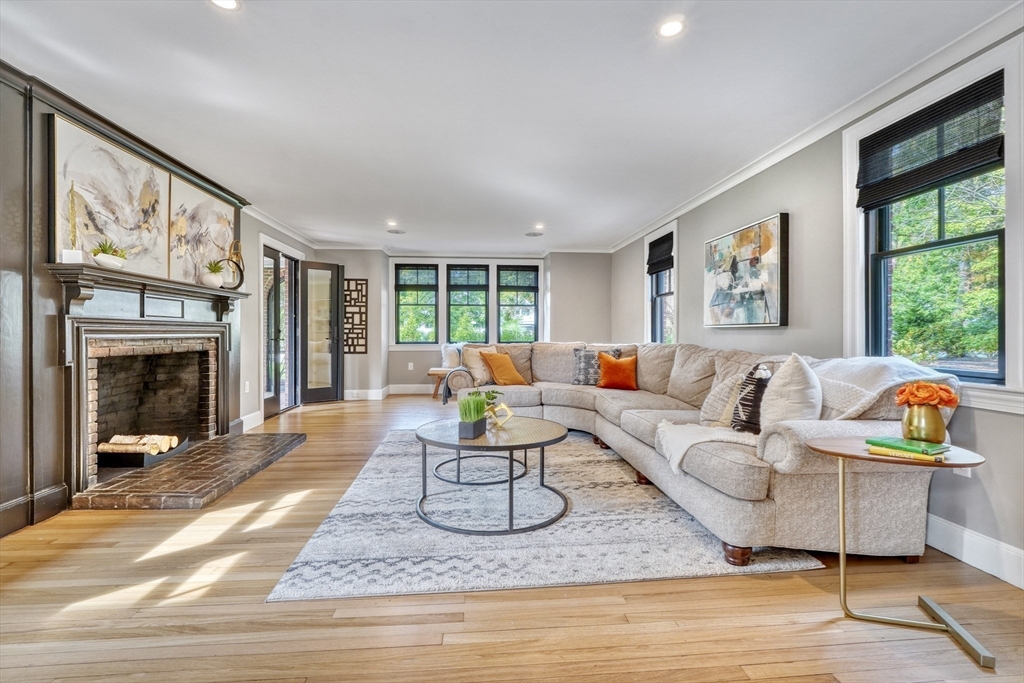 27 Cabot Street Winchester, MA 01890 - Photo 16 of 42 a living room with furniture a fireplace and a large window