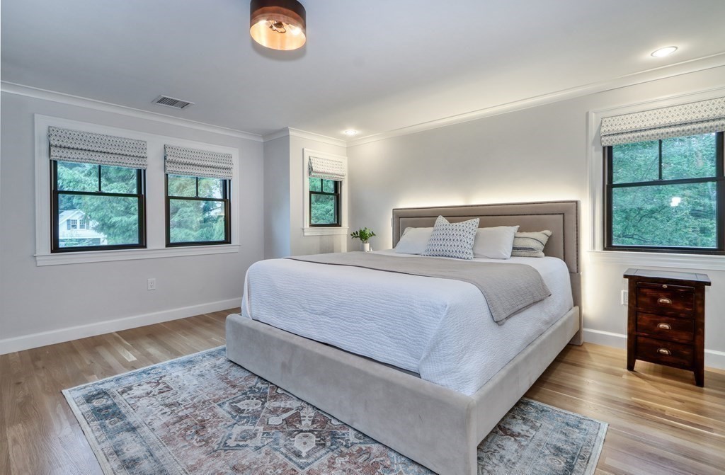 27 Cabot Street Winchester, MA 01890 - Photo 23 of 42 a bedroom with a large bed and a window
