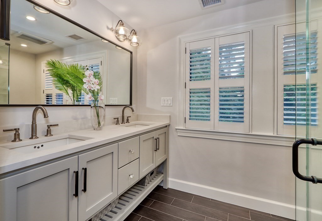 27 Cabot Street Winchester, MA 01890 - Photo 26 of 42 a bathroom with double vanity and a mirror