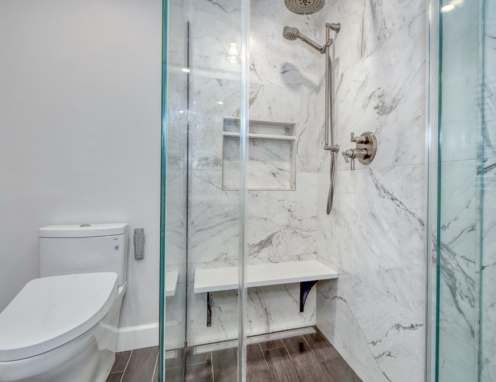 27 Cabot Street Winchester, MA 01890 - Photo 27 of 42 a bathroom with a toilet and a shower