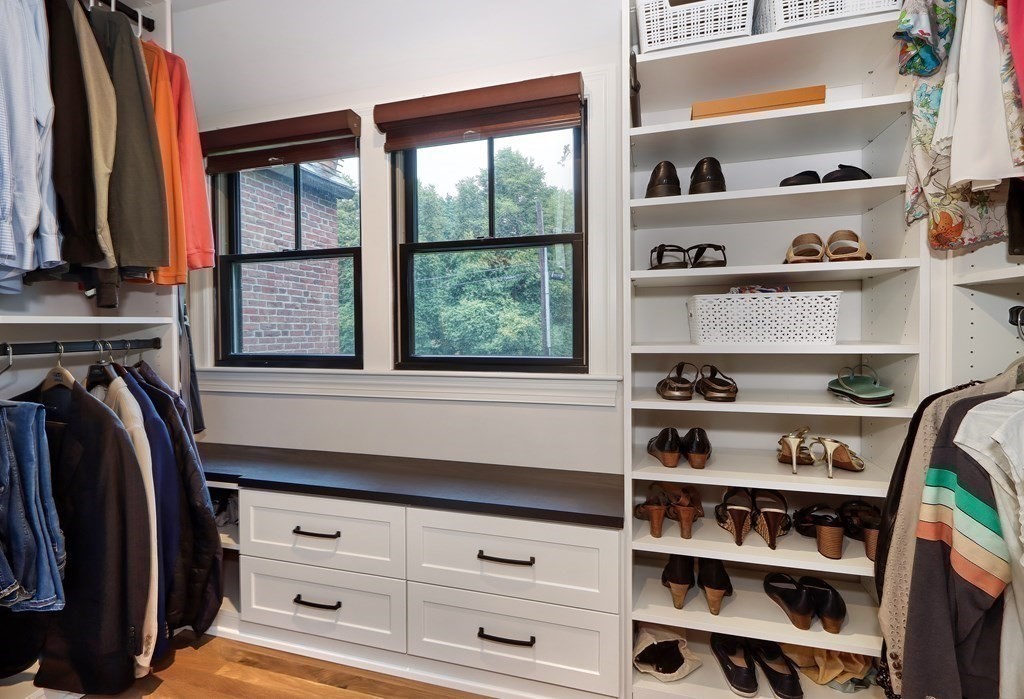 27 Cabot Street Winchester, MA 01890 - Photo 28 of 42 a view of walk in closet with clothes and shoes