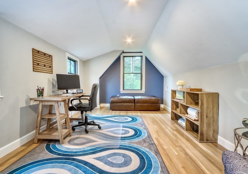 27 Cabot Street Winchester, MA 01890 - Photo 35 of 42 a living room with furniture and a flat screen tv