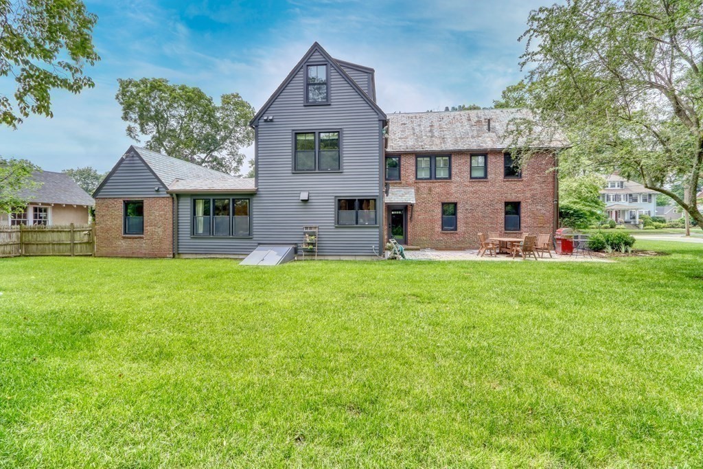 27 Cabot Street Winchester, MA 01890 - Photo 41 of 42 a front view of a house with garden