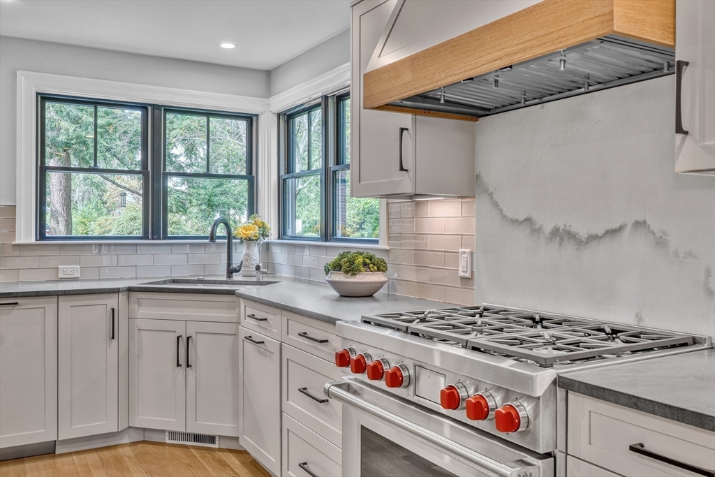 27 Cabot Street Winchester, MA 01890 - Photo 7 of 42 a kitchen with granite countertop a stove and a sink