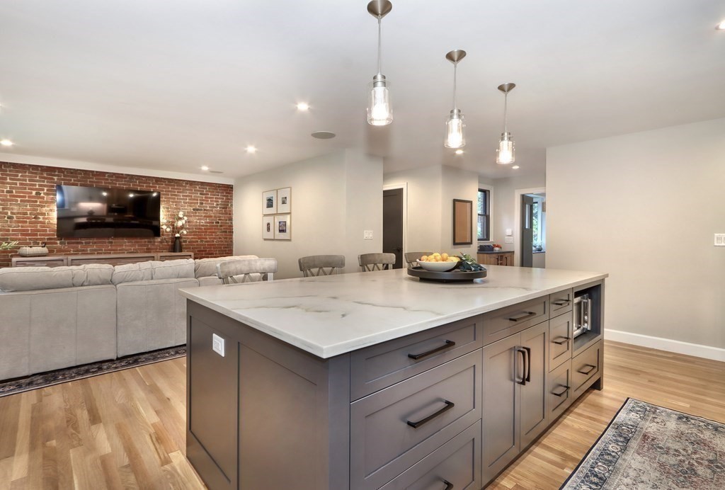 27 Cabot Street Winchester, MA 01890 - Photo 9 of 42 a kitchen with a sink a counter space appliances and cabinets