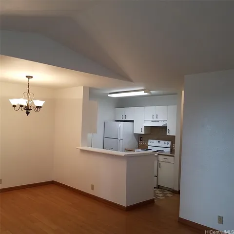 a kitchen with a sink cabinets and window