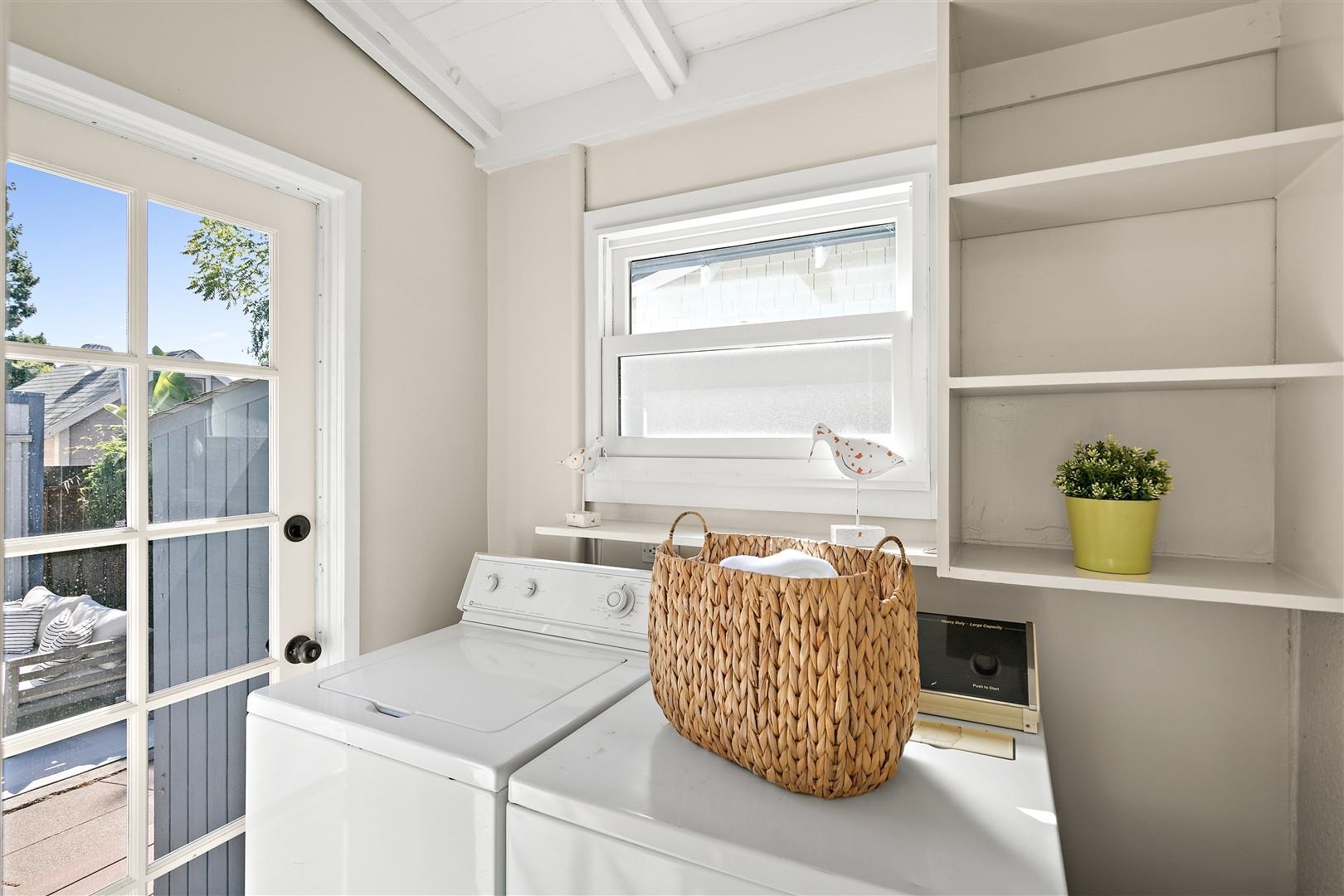 1436 Delaware Street Berkeley, CA 94702 - Photo 25 of 60 Laundry room featuring beamed ceiling and washer and clothes dryer