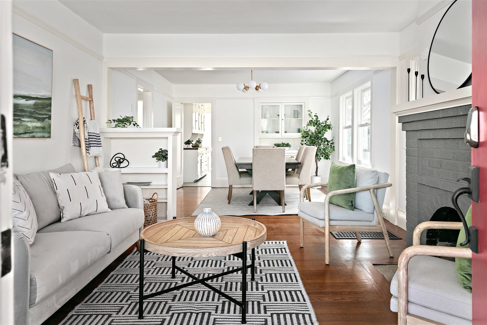 1436 Delaware Street Berkeley, CA 94702 - Photo 9 of 60 Living room with dark wood-style floors and a chandelier