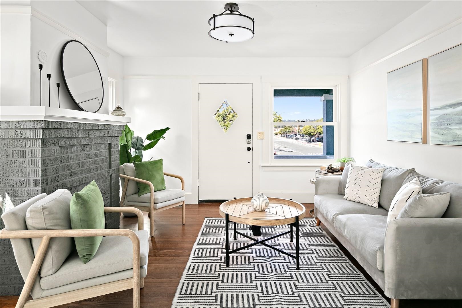 1436 Delaware Street Berkeley, CA 94702 - Photo 10 of 60 Living room featuring a brick fireplace and dark wood-style floors