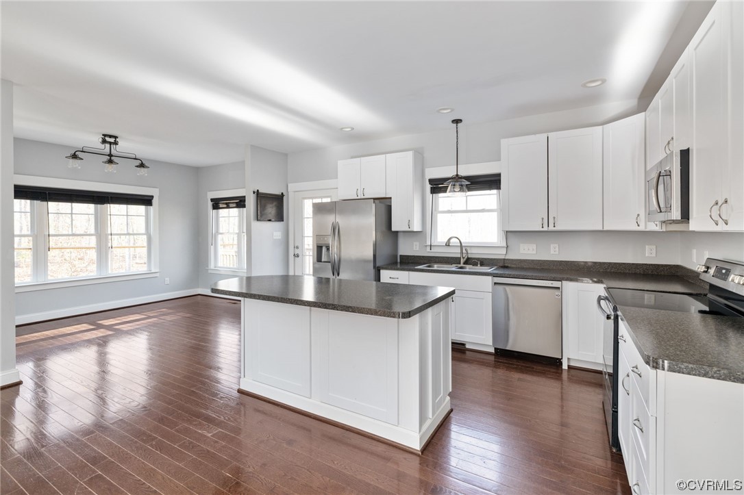 3160 Three Chopt Road Gum Spring, VA 23065 - Photo 11 of 47 a kitchen with granite countertop white cabinets and wooden floor