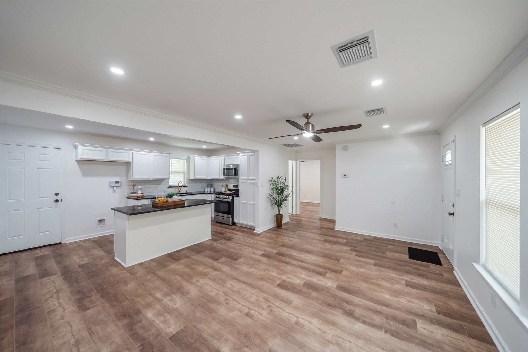 3051 Rothermel Road Houston, TX 77093 - Photo 6 of 24 Bright and spacious living/dining area with modern finishes and open layout, beautiful laminate flooring.