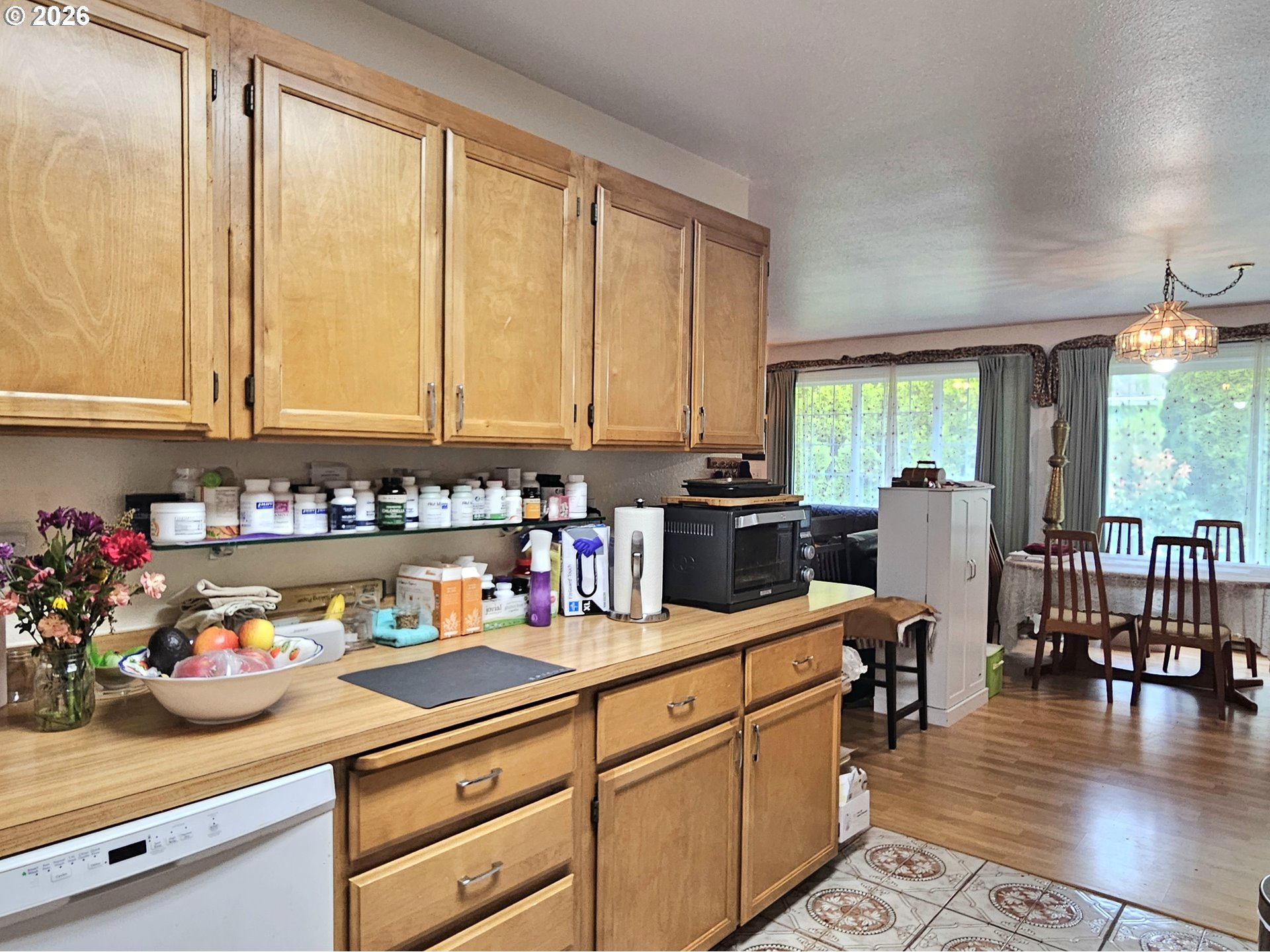 15482 Morrison Lane Brookings, OR 97415 - Photo 16 of 42 a kitchen with lots of counter top space and wooden floor