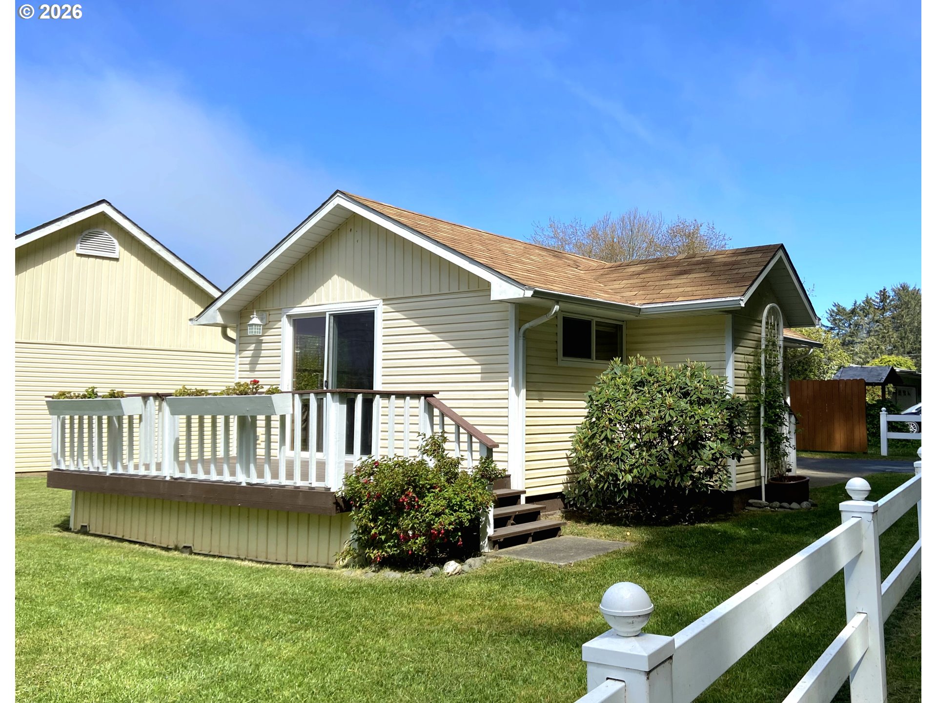 15482 Morrison Lane Brookings, OR 97415 - Photo 33 of 42 a front view of a house with garden