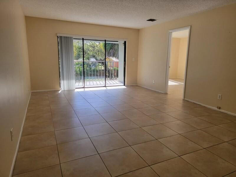 2516 South 19th Street, Unit 208 Fort Pierce, FL 34982 - Photo 11 of 15 a view of an empty room and a window