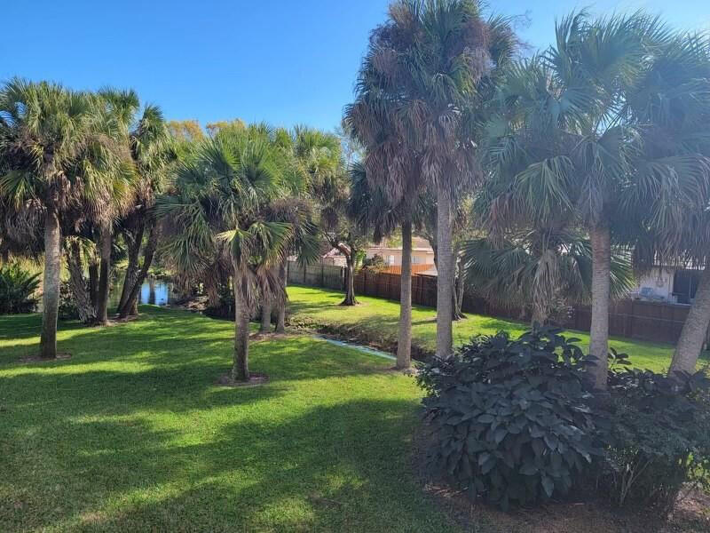 2516 South 19th Street, Unit 208 Fort Pierce, FL 34982 - Photo 4 of 15 a park view with large trees