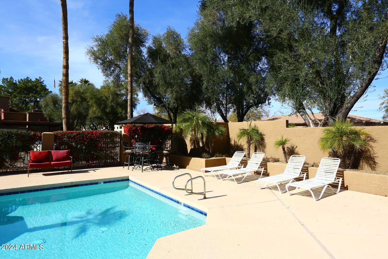 6945 East Cochise Road, Unit 122 Paradise Valley, AZ 85253 - Photo 23 of 35 Community Pool Lounge Area