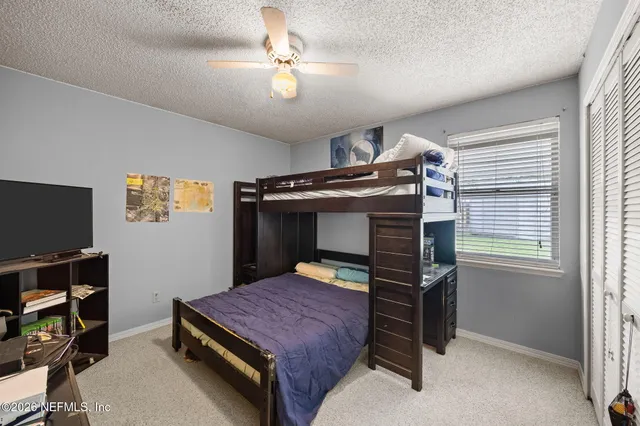 a view of a swimming pool with a lounge chairs