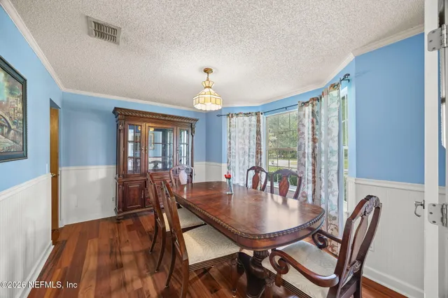 a kitchen with a refrigerator a sink and a stove