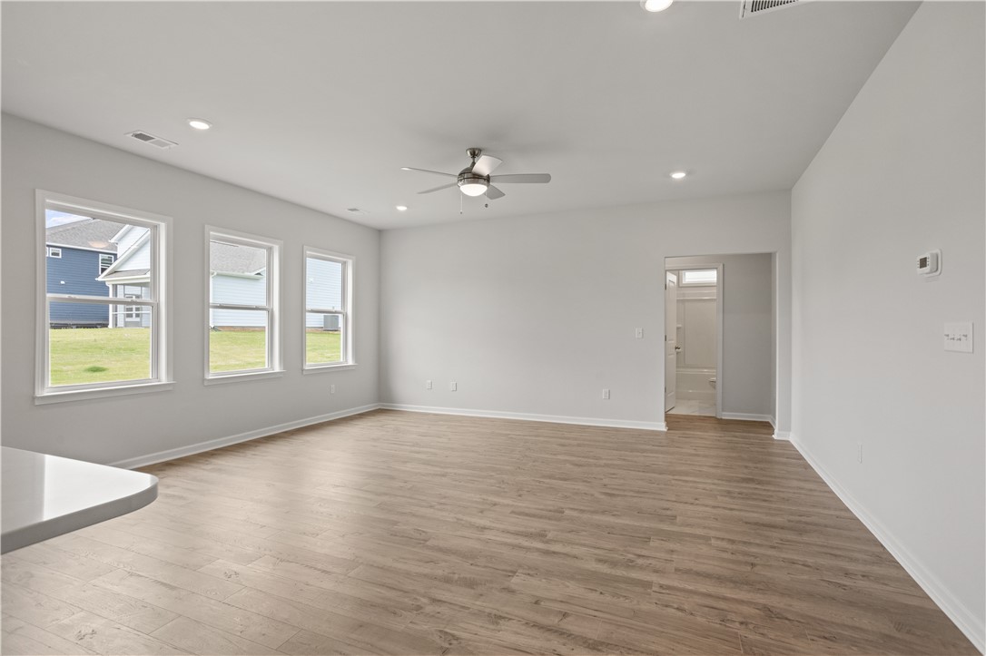 555 Hydrangea Street, Unit LOT 47 Seneca, SC 29678 - Photo 14 of 38 A versatile living space with light-colored flooring and ample natural light.