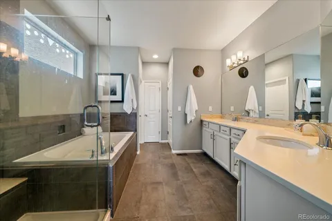a utility room with sink dryer and washer