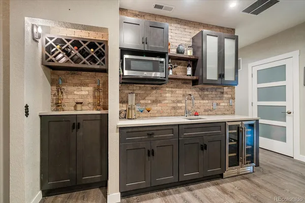 a kitchen with stainless steel appliances granite countertop a stove and a microwave