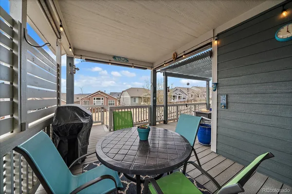 a balcony view with a seating space