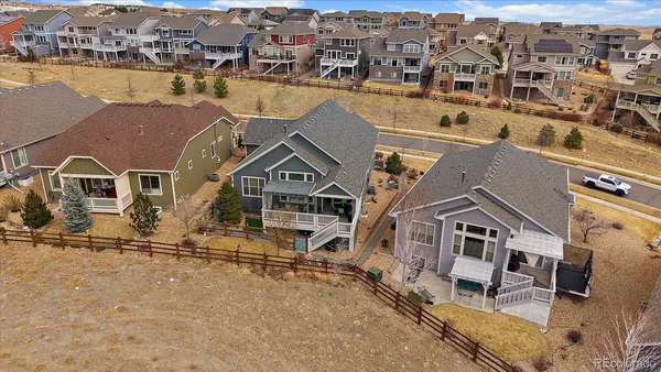 an aerial view of a house with a yard