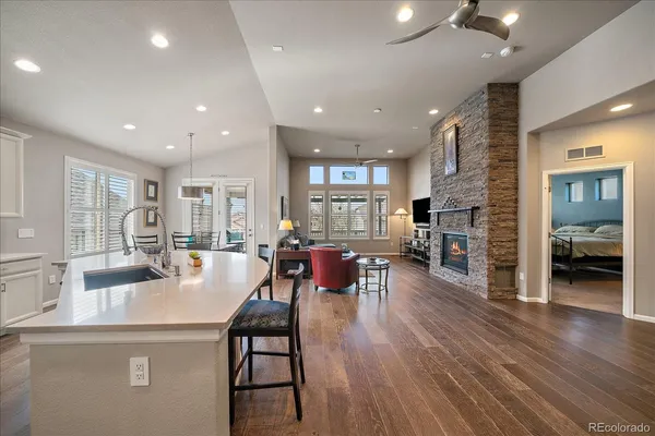 a dining room with furniture and wooden floor
