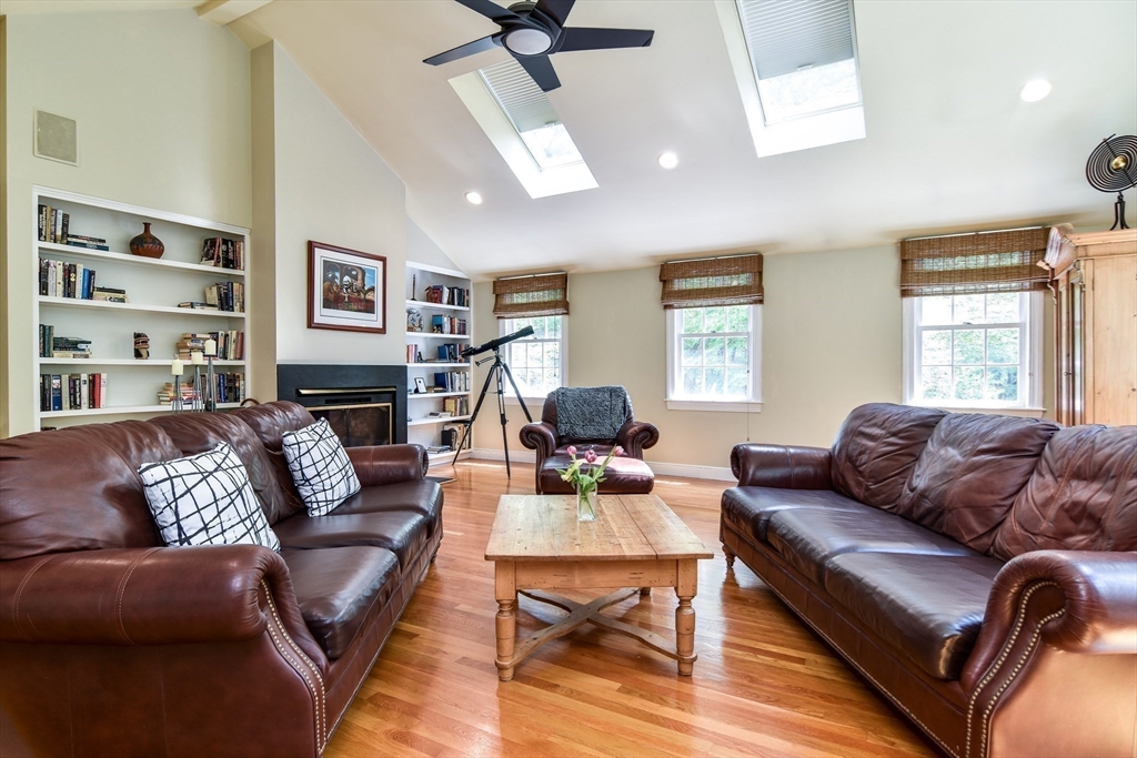 114 Hunters Ridge Road Concord, MA 01742 - Photo 18 of 38 a living room with furniture ceiling fan and a window