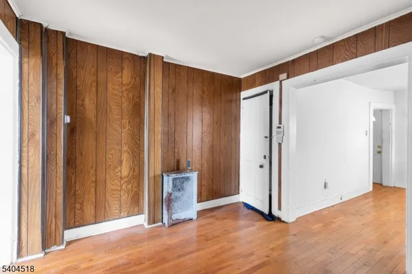a view of a livingroom with wooden floor