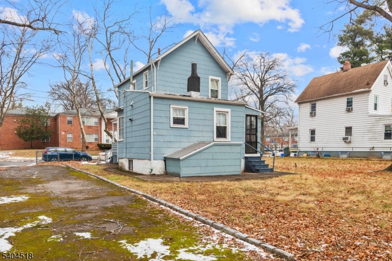 354 Hayward Street Orange, NJ 07050 - Photo 18 of 18 a view of a house with snow on the road