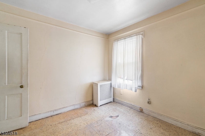 354 Hayward Street Orange, NJ 07050 - Photo 8 of 18 an empty room with windows