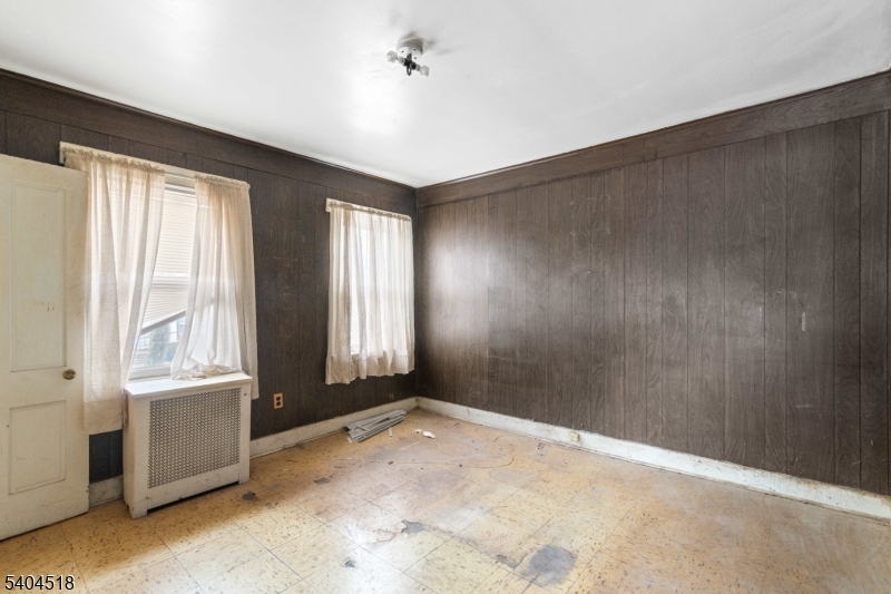 354 Hayward Street Orange, NJ 07050 - Photo 10 of 18 a view of an empty room with a window